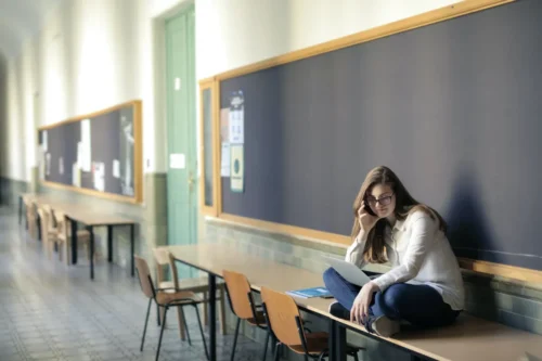 Girl sitting in classroom- Interested in Computer Science